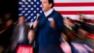 Ron DeSantis speaks, American flag background | Nikhinson Julia/ABACA/Newscom