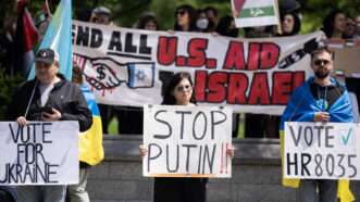 Protesters demonstrating for and against U.S. military aid | Tom Williams/CQ Roll Call/Newscom