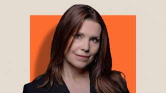 Annie Duke headshot against a smaller orange box placed against a cream background | Lex Villena, Reason