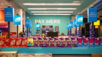 Duty free shop at Heathrow Airport with signs of PAY HERE and SELF SERVICE CHECKOUT | Photo 257565209 © I Wei Huang | Dreamstime.com