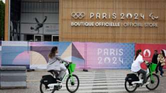 Bike riders outside a 2024 Paris Olympics Game building | Telmo Pinto / SOPA Images/Sipa USA/Newscom