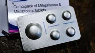 Packet of mifepristone and misoprostol tablets | Comstock image: DPST/Newscom;  Pills: Soumyabrata Roy/ZUMAPRESS/Newscom