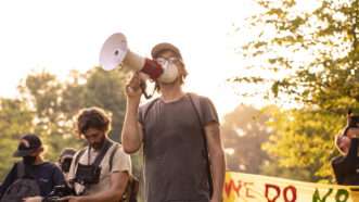 Protesters in Atlanta's Gresham Park oppose the Atlanta Public Safety Training Center, known as "Cop City" by opponents. | Steve Eberhardt/ZUMAPRESS/Newscom