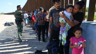 Migrants wait to be processed at the U.S.-Mexico border in Eagle Pass, Texas | Miguel Juarez Lugo/ZUMAPRESS/Newscom