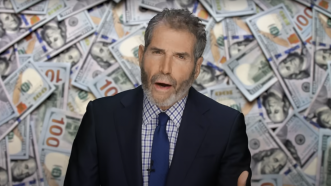 John Stossel is seen in front of stacks of 0 bills | Stossel TV