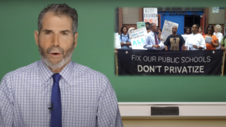 John Stossel is seen next to a sign that says, "Fix our public schools, Don't privatize" | Stossel TV